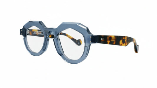 Eyeglasses with a blue frame and tortoiseshell accents on a white background