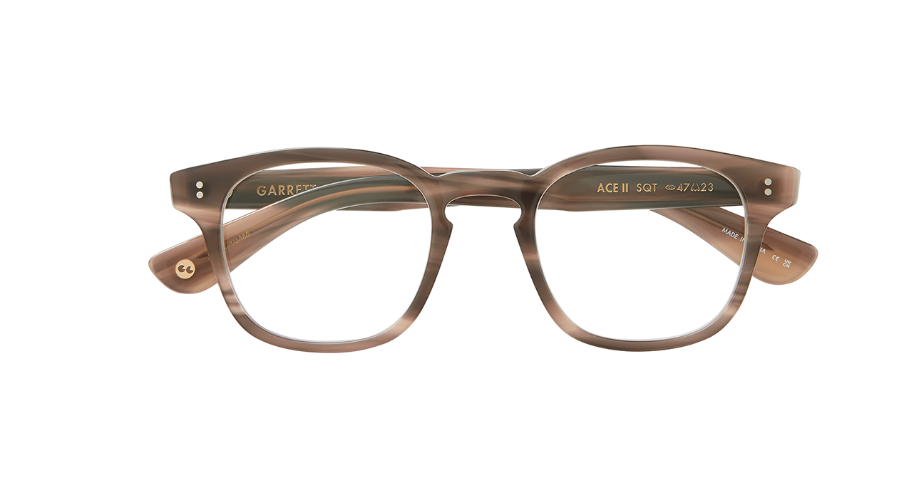 the cult-favorite Ace Sun transformed into an optical. Ace II reflects the standard way in which we design and create premium eyewear. We’re not reinventing the wheel here – just putting some rims on ‘em. In Sequoia Tortoise, an ashy light brown tortoise shell like pattern. This image shows the frame with the arms folded..