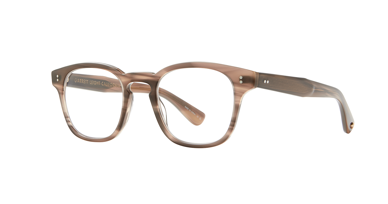 the cult-favorite Ace Sun transformed into an optical. Ace II reflects the standard way in which we design and create premium eyewear. We’re not reinventing the wheel here – just putting some rims on ‘em. In Sequoia Tortoise, an ashy light brown tortoise shell like pattern. This image shows the sideview of the frame.