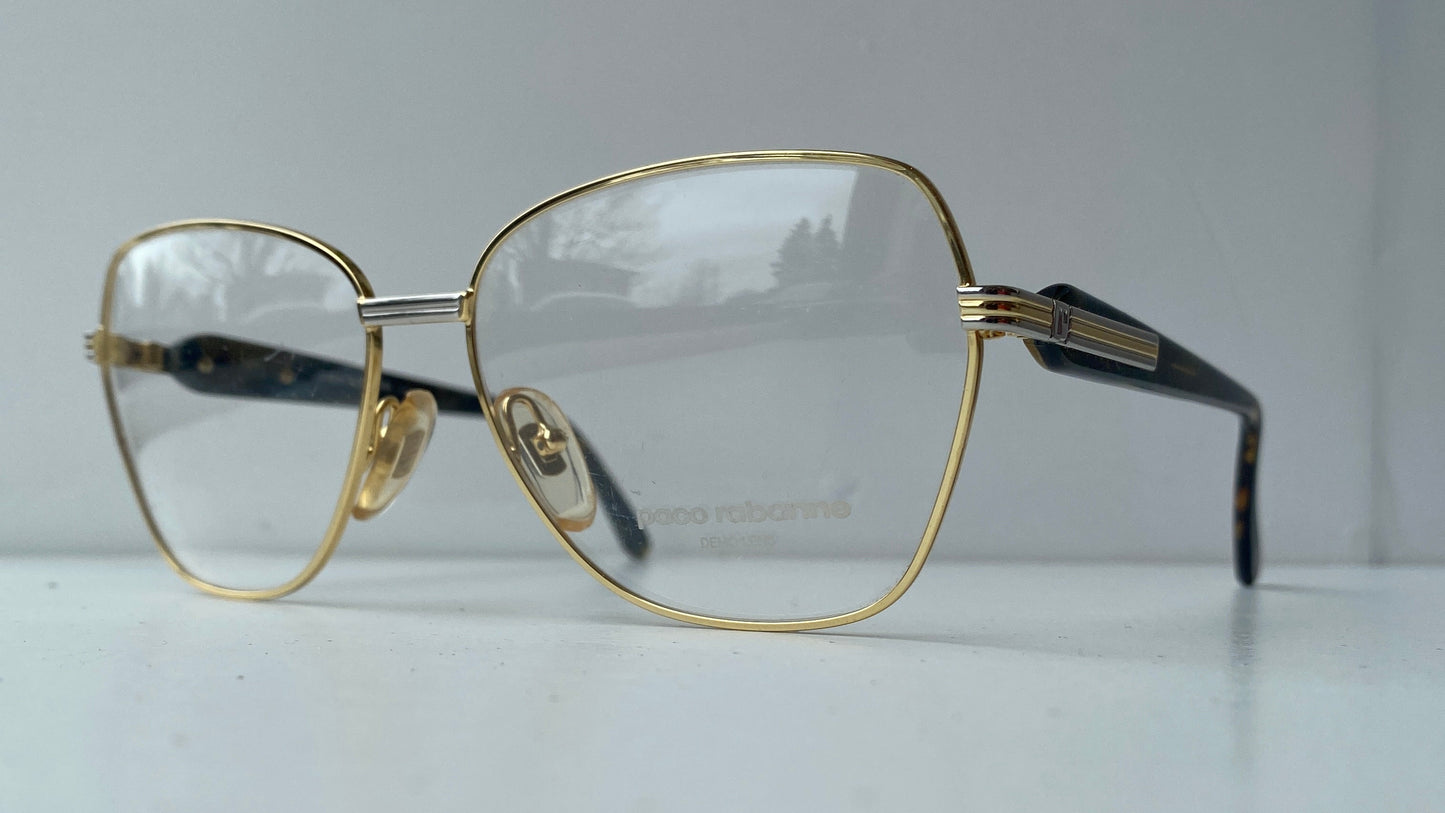 Gold-framed eyeglasses on a white background