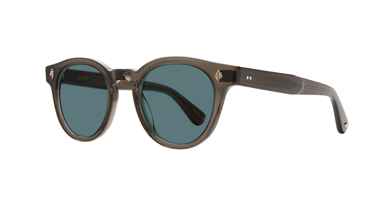 Sunglasses with dark lenses and brown frame on a white background