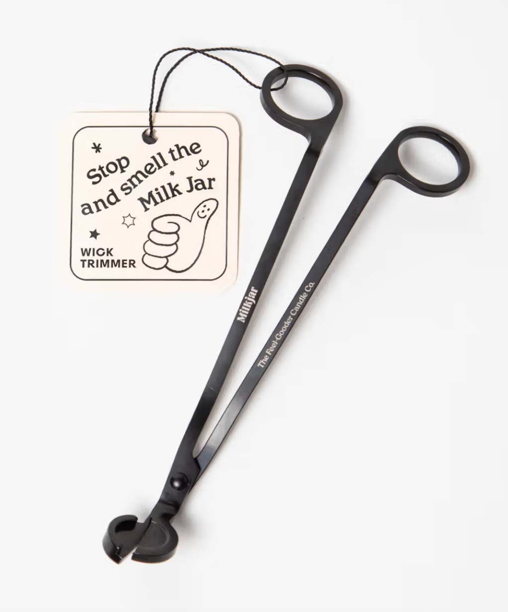 Milkjar black wick trimmer with a tag on a white background