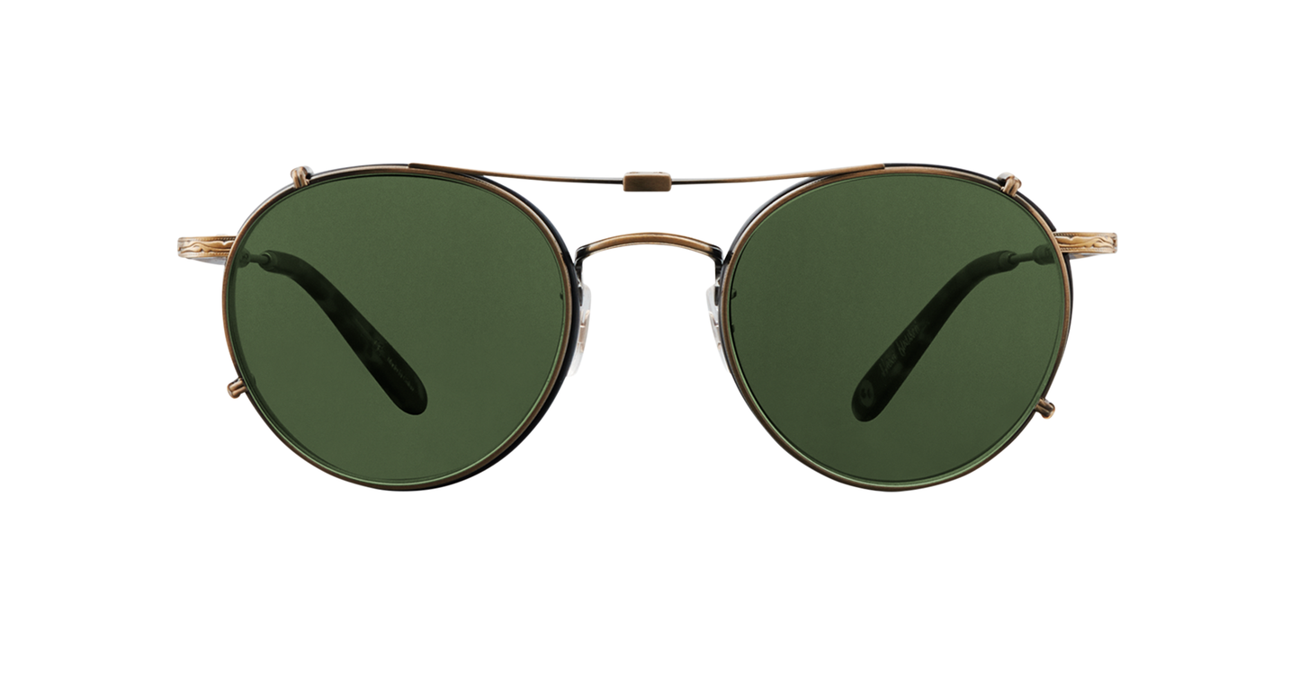 A antique gold Garrett Leight stainless steel folding sun clip with green tinted lenses, designed to attach to Wilson eyeglasses, displayed against a plain background.